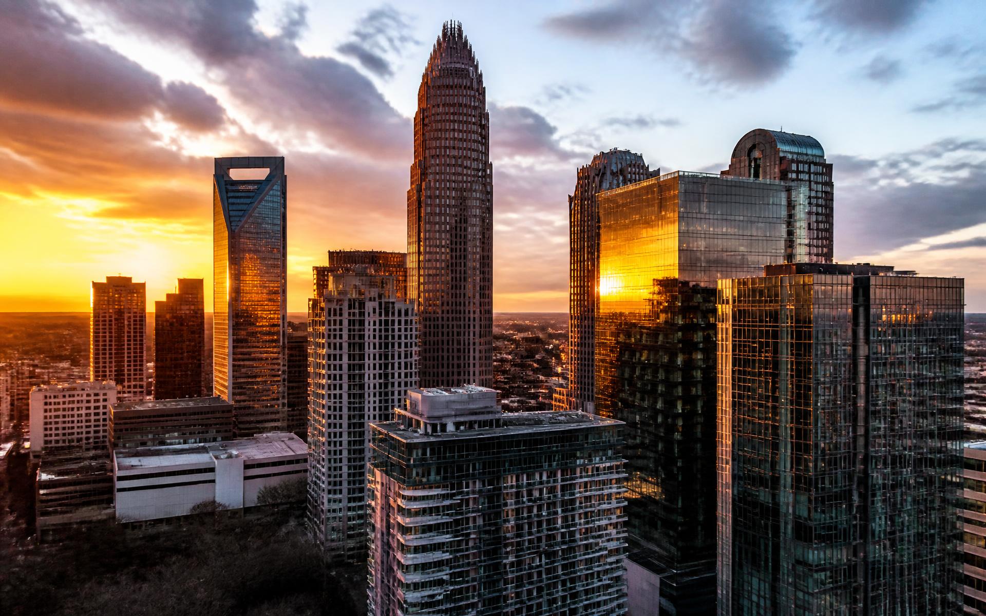 Uptown Charlotte skyline at golden hour above the four wards